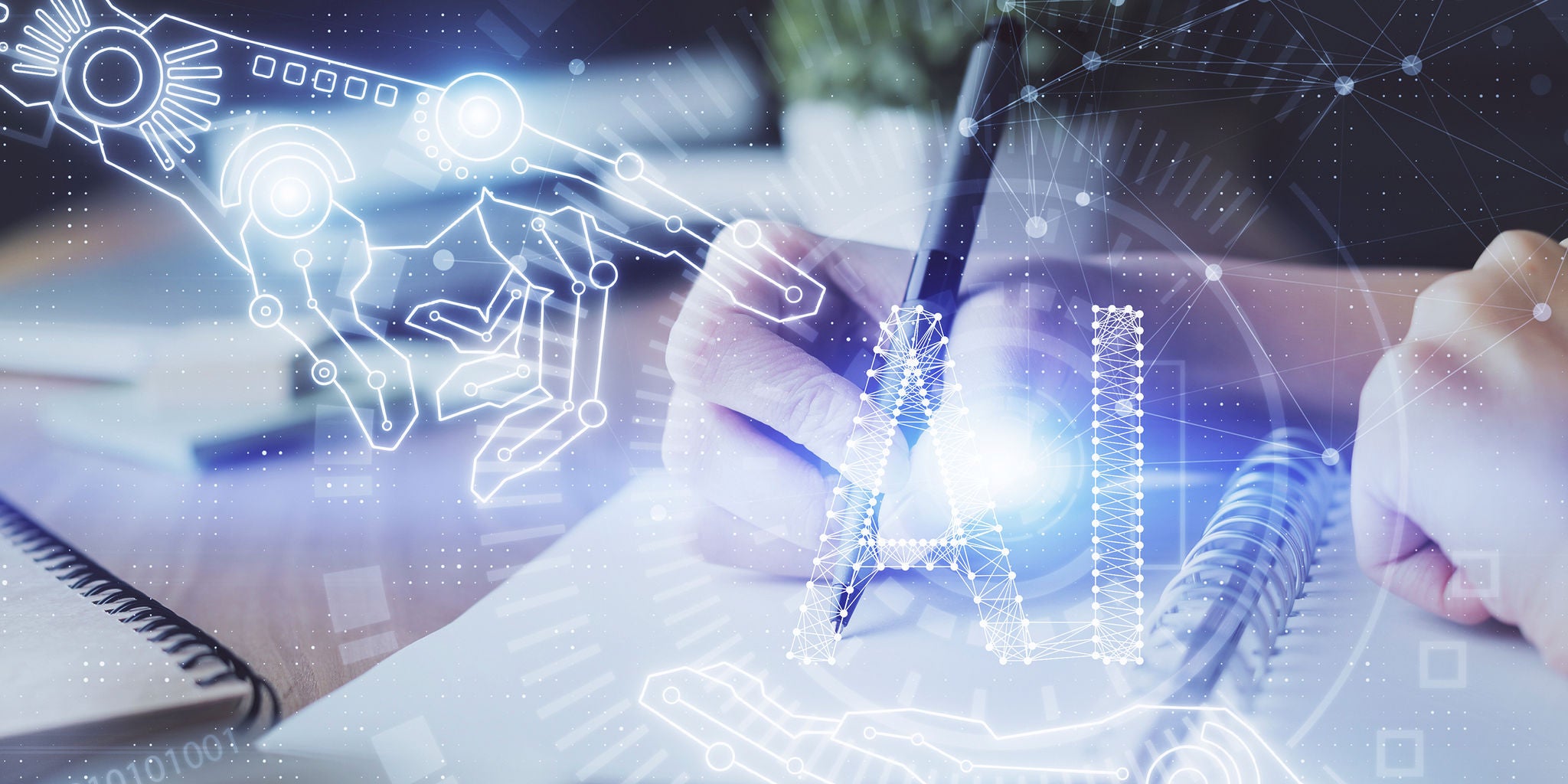 A person writes in a notebook while a digital illustration of a robotic hand and the letters 'AI' are superimposed. The setting suggests a blend of technology and creativity, highlighting artificial intelligence. The image uses a cool, futuristic color palette with blue and white tones. The scene conveys innovation and the intersection of human and machine intelligence.