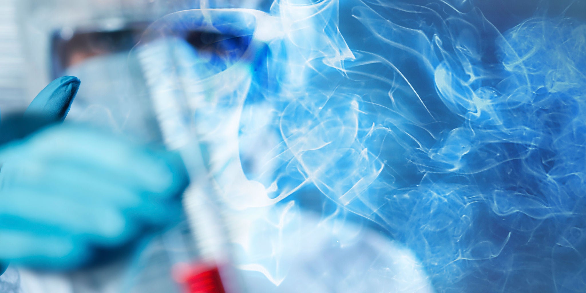 A person wearing protective laboratory gear and gloves is handling a test tube or vial, surrounded by swirling vapor or smoke. The setting appears to be a scientific laboratory, with a focus on experimental or chemical processes. The image uses a cool blue palette, creating a clinical and high-tech atmosphere. No visible text or numbers are present in the image.