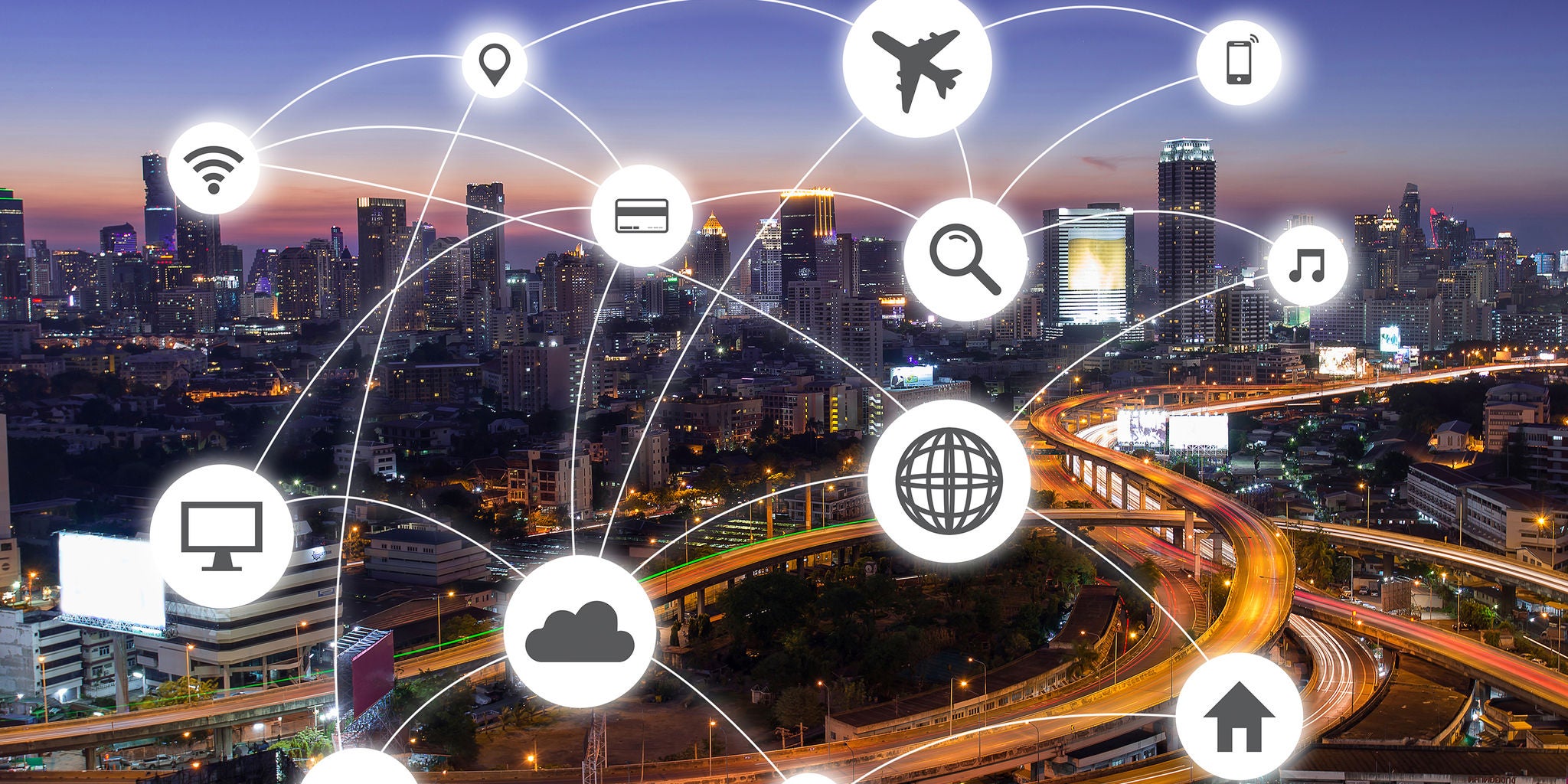 A vibrant cityscape at dusk features illuminated skyscrapers and highways, overlaid with digital network icons. The icons represent various technologies such as Wi-Fi, cloud, search, music, and travel, visually connected by glowing lines. The scene highlights the concept of a connected smart city, emphasizing digital integration and modern infrastructure.