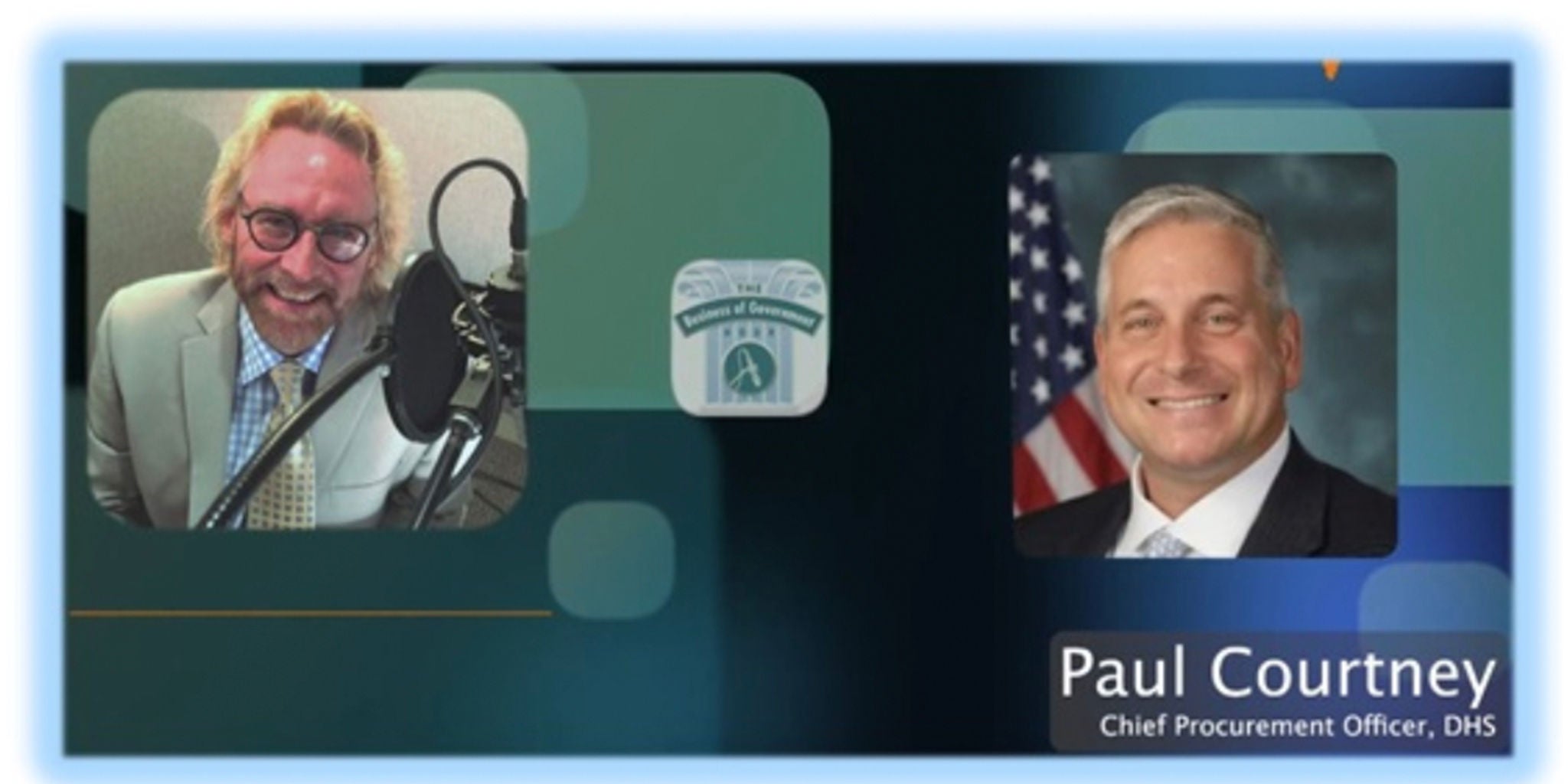 A virtual event featuring a discussion with a DHS official. The setting includes a microphone and a professional backdrop with visible text reading 'Paul Courtney, Chief Procurement Officer, DHS.' The visuals also include a badge-like emblem in the center.