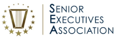 The image features the text 'Senior Executives Association' arranged vertically with the acronym 'SEA' highlighted. To the left, there is a gold harp-like icon encircled by stars, adding a formal and professional touch. The overall palette is gold and navy blue, conveying a sense of prestige and authority.