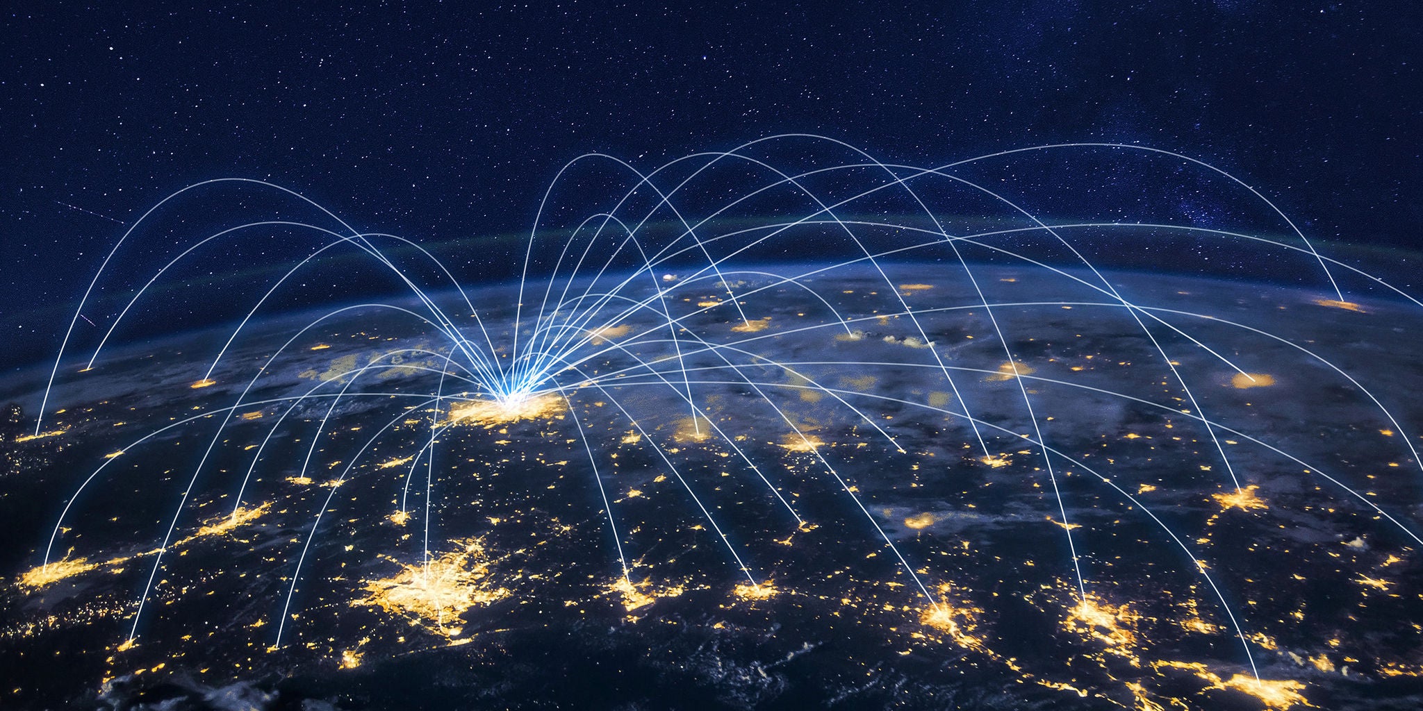 A view of Earth from space at night shows illuminated cities connected by glowing blue lines, representing a global network. The lines converge at a central bright point, suggesting a hub of connectivity. The image uses a dark blue and yellow color palette, highlighting technological and digital communication themes. No visible text or numbers are present in the image.