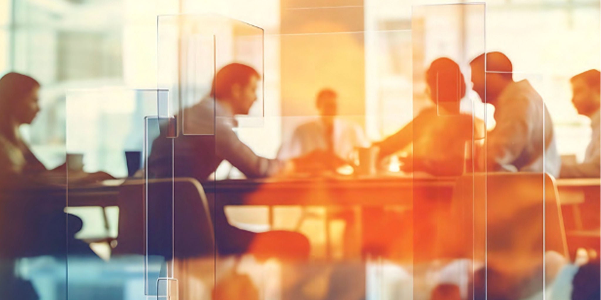 A group of professionals is seated around a table in a modern office environment, engaging in a collaborative discussion. The scene is illuminated with warm, orange-toned lighting, creating a dynamic and energetic atmosphere. Abstract geometric overlays add a contemporary visual element to the image.